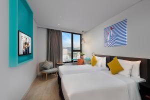 Giường trong phòng chung tại ibis Styles Nha Trang