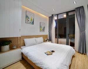 Voodi või voodid majutusasutuse L'amie Hotel & Studio toas