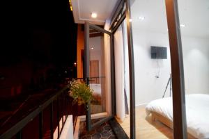 Voodi või voodid majutusasutuse L'amie Hotel & Studio toas
