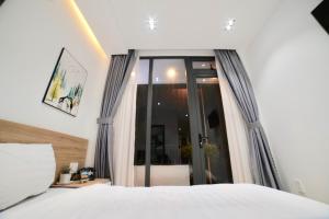 Voodi või voodid majutusasutuse L'amie Hotel & Studio toas