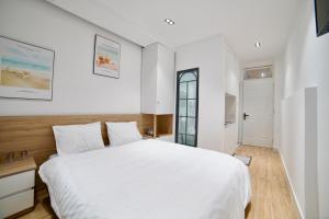 Voodi või voodid majutusasutuse L'amie Hotel & Studio toas