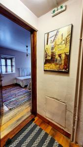 a living room with a painting on the wall at Varosi Guesthouse in Edessa