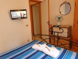 Posteľ alebo postele v izbe v ubytovaní Profumo di lavanda Taormina