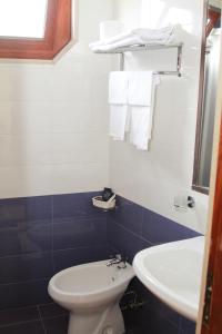Koupelna v ubytování Hotel Riviera