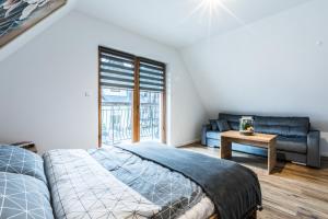 Katil atau katil-katil dalam bilik di Apartament Parzenica