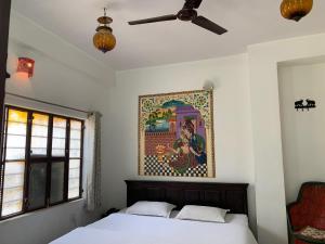 Säng eller sängar i ett rum på Vinayak Guest House