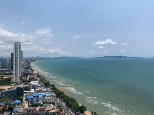 an aerial view of the ocean and a beach at Inn Residence Serviced Suites - SHA Extra Plus in Jomtien Beach