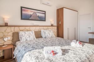 Postel nebo postele na pokoji v ubytování Villa LAURA