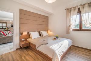 Postel nebo postele na pokoji v ubytování Villa LAURA