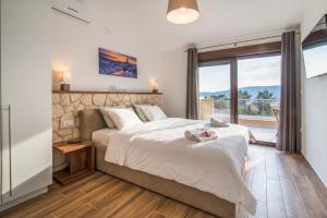 Postel nebo postele na pokoji v ubytování Villa LAURA