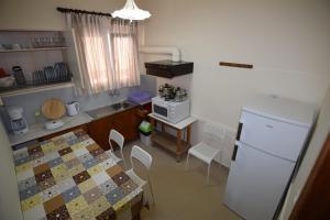 Kuchyň nebo kuchyňský kout v ubytování Jimmy's Apartments