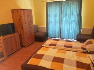 Posteľ alebo postele v izbe v ubytovaní Ilona Apartmanház