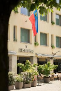 a building with a flag in front of it at Residence Hotel in Vaduz
