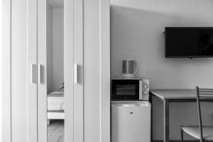 A television and/or entertainment centre at Suite Eleven