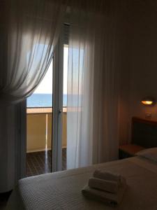 Postel nebo postele na pokoji v ubytování Hotel Artide