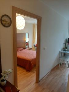 Postel nebo postele na pokoji v ubytování Amber apartamentai