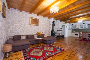 a living room with a couch and a table at EASY HOLIDAY in Skradin