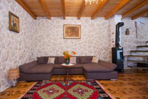 a living room with a couch and a table at EASY HOLIDAY in Skradin