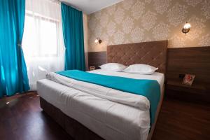 Postel nebo postele na pokoji v ubytování Vila Levent Mangalia
