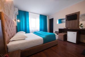 Postel nebo postele na pokoji v ubytování Vila Levent Mangalia