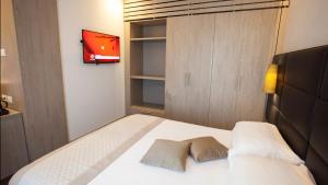 Postel nebo postele na pokoji v ubytování Hotel Principe Palace