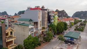 arial view of a city with buildings and a street at Candy Hotel in Ha Long