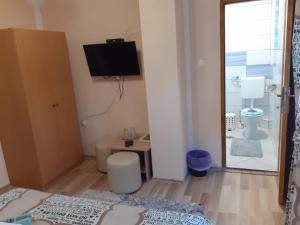 TV a/nebo společenská místnost v ubytování Rooms Luka
