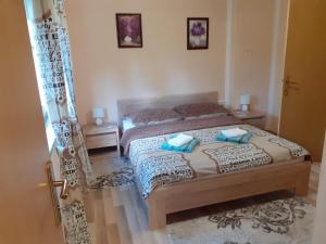 Postel nebo postele na pokoji v ubytování Rooms Luka