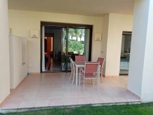 a patio with a table and chairs in a house at Ground floor with view by Bev in San Javier