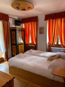 Кровать или кровати в номере Hotel Capriolo