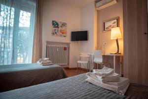 A bed or beds in a room at Civico 8 B&B - Appartamento