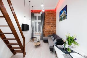 Televiisor ja/või meelelahutuskeskus majutusasutuses DIETLA 99 APARTMENTS - IDEAL LOCATION - in the heart of Krakow