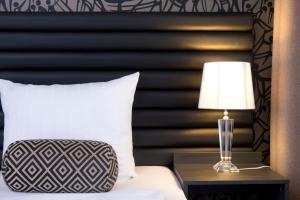 Postel nebo postele na pokoji v ubytování Park Hotel am Berliner Tor