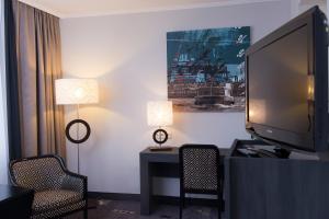 TV a/nebo společenská místnost v ubytování Park Hotel am Berliner Tor