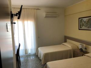 Posteľ alebo postele v izbe v ubytovaní Hostal Internacional