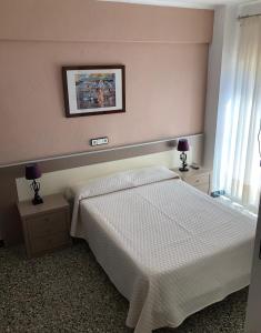Posteľ alebo postele v izbe v ubytovaní Hostal Internacional