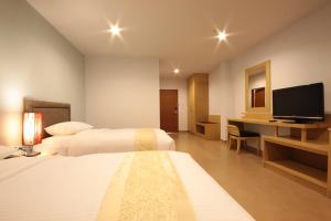 Krevet ili kreveti u jedinici u okviru objekta Paragon Suites Resort