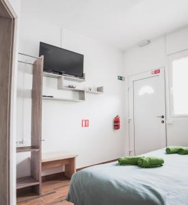 Televisor o centre d'entreteniment de Apartmaji Hrast - Podbela