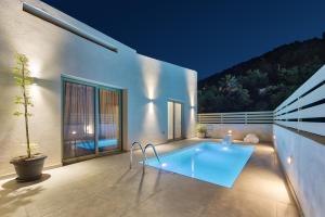 a swimming pool in the backyard of a house at Casa Elianna in Zakynthos