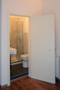 a bathroom with a toilet and a shower and a sink at B&B Thule in Caltanissetta