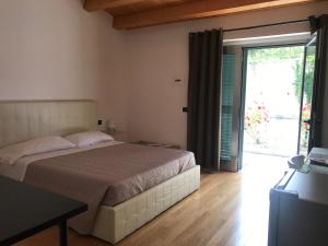 Postel nebo postele na pokoji v ubytování B&B Oasi Vetoio