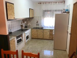Virtuvė arba virtuvėlė apgyvendinimo įstaigoje Casa Los Hortets