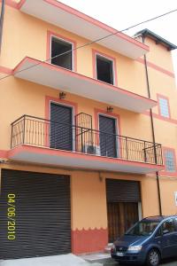 a building with a car parked in front of it at B&B Mediterraneo in Torre Melissa +7 photos