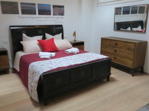 Ein Bett oder Betten in einem Zimmer der Unterkunft Foresteria Conti, sulle tracce di Shakespeare