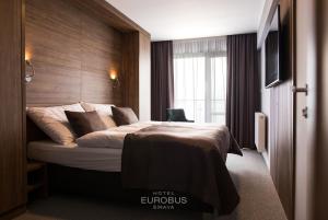 Ліжко або ліжка в номері Hotel Eurobus