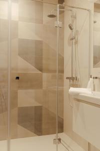 a bathroom with a shower and a sink at APARTAMENT Marina Port in Wrocław