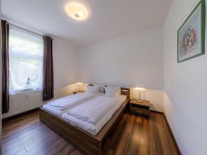 Postel nebo postele na pokoji v ubytování Ferienhaus Seeperle