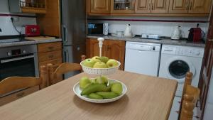 Una cocina o zona de cocina en Casa de Huéspedes Vecinodecerbantes