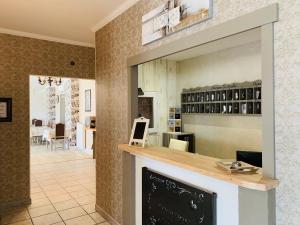 a living room with a fireplace and a dining room at Domaine de Roullet in Roullet