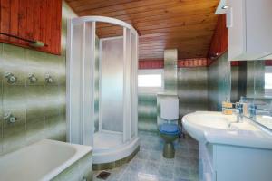 a bathroom with a shower and a sink and a toilet at Horizont view apartment in Pula +37 photos